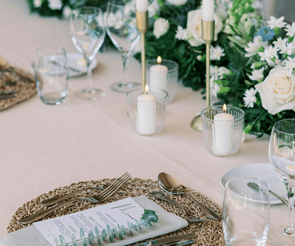 Elegant table setting with candles and flowers